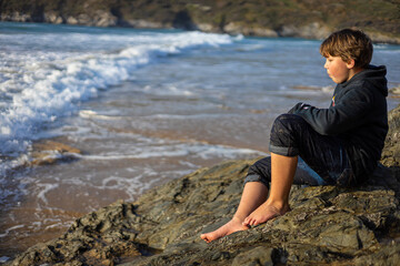 Boy enjoying the seaside of Cornwall, UK