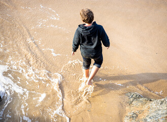 Boy enjoying the seaside of Cornwall, UK