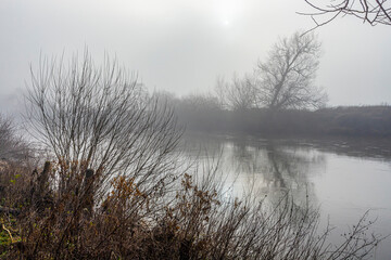 Gloomy light on a misty day on the River Wye at Huntsham Bridge, Herefordshire, England UK