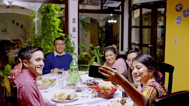 Family Portrait Of An Indigenous Family Having Dinner.