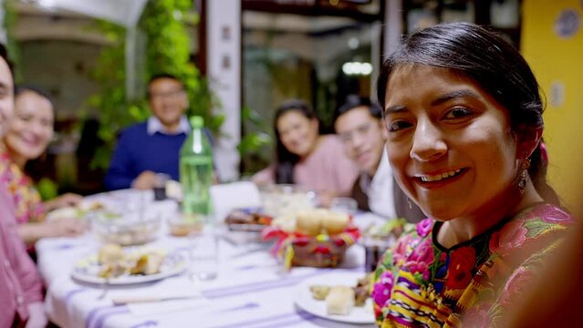 Family Portrait Of An Indigenous Family Having Dinner.