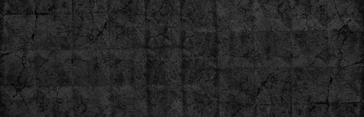 Old black concrete slab wide panoramic texture. Cracked aged cement surface large backdrop. Dark gloomy grunge abstract background