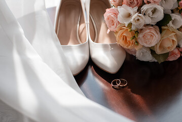 bride's shoes bouquet wedding rings. preparations before the ceremony