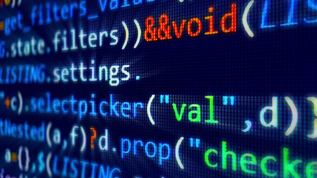 A close-up view of computer programming code playing on an LCD screen at high speed - seamless looping.
