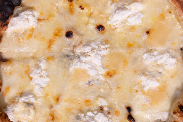 Delicious pizza Four cheeses with cheddar, parmesan, mozzarella and ricotta.Pizza background. View from above.