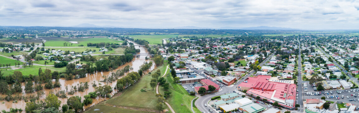 Town of Singleton beside flooding river with brown floodwaters