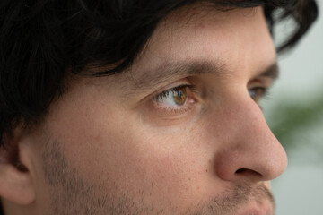 Fototapeta premium Extreme close-up of a man's eyes looking sideways. 