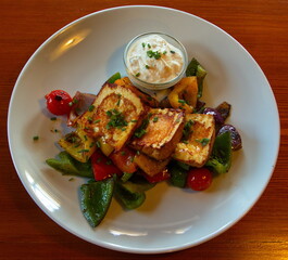 Grilled cheese and vegetables in a restaurant in Czech Republic,Europe,Central Europe
