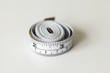 sewing tape measure on white copy space