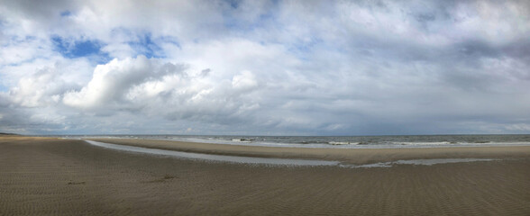 Fototapeta na wymiar Northsea coast. Beach and sea. Julianadorp Netherlands. Panorama.