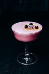 A refreshing alcoholic cocktail of gin grapefruit juice and raspberry puree.  cocktail menu.