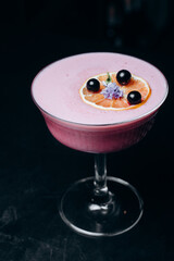 A refreshing alcoholic cocktail of gin grapefruit juice and raspberry puree.  cocktail menu.