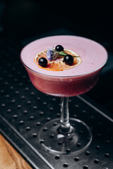 A refreshing alcoholic cocktail of gin grapefruit juice and raspberry puree.  cocktail menu.