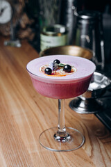 A refreshing alcoholic cocktail of gin grapefruit juice and raspberry puree.  cocktail menu.