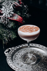 Traditional winter eggnog with milk, rum and cinnamon, sprinkle chocolate,selective focus.Close up.