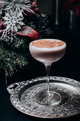 Traditional winter eggnog with milk, rum and cinnamon, sprinkle chocolate,selective focus.Close up.