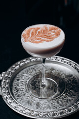 Traditional winter eggnog with milk, rum and cinnamon, sprinkle chocolate,selective focus.Close up.