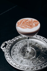 Traditional winter eggnog with milk, rum and cinnamon, sprinkle chocolate,selective focus.Close up.