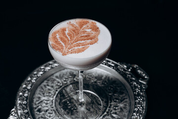 Traditional winter eggnog with milk, rum and cinnamon, sprinkle chocolate,selective focus.Close up.