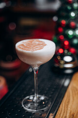Traditional winter eggnog with milk, rum and cinnamon, sprinkle chocolate,selective focus.Close up.