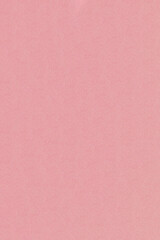 Textured background of light pink kraft paper. Background with a texture of simple pink paper. crimson retro paper background. Vintage cardboard texture. Grunge-style drawing paper