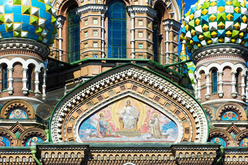 Fototapeta na wymiar Church of the Savior on Spilled Blood, a fragment of a southern facade. Domes and fresco of Spas-na-krovi cathedral. St.Petersburg, Russia