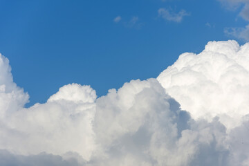 Natural daylight and white clouds floating on blue sky.