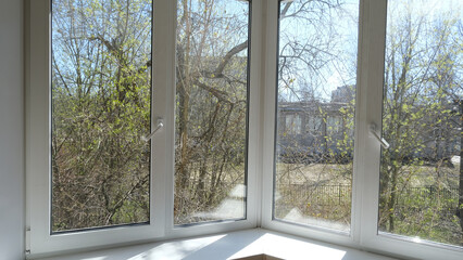 Fototapeta na wymiar View from the window on the spring trees.