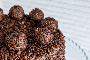 Chocolate cake with brigadeiro granules, delicious dessert close up.