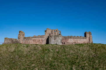 Fototapeta na wymiar Tantallon Castle walls under clear blue sky