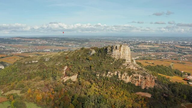 Rock of Solutré - limestone escarpment west of Mâcon, France, overlooking the commune of Solutré-Pouilly. Aerial view.