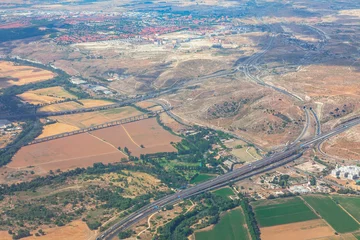 Keuken spatwand met foto Madrid suburb view from the plane . Aerial view of roads and landscapes in Spain  © russieseo
