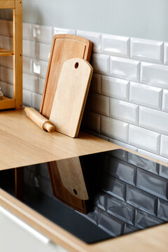 Vertical Background Image Of Minimal Kitchen Interior With Focus On Black Glass Stovetop, Copy Space