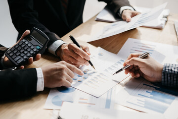 Business man group are meeting together in the office, they are meeting on the topic of finance and financial management, they are business partners. Concept financial management for startup companies