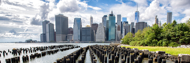New York City Skyline panoramic banner showing Midtown and Lower Manhattan from the Brooklyn Bridge...