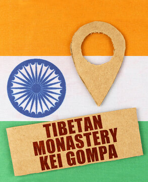 On the Indian flag, a geolocation symbol and a sign with the inscription - Tibetan monastery Kei Gompa