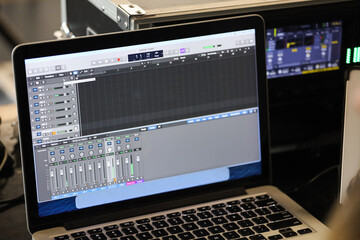 laptop with mixer and live broadcast director's remote control