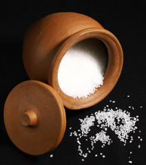 Sugar in a clay pot with an open lid. Close-up