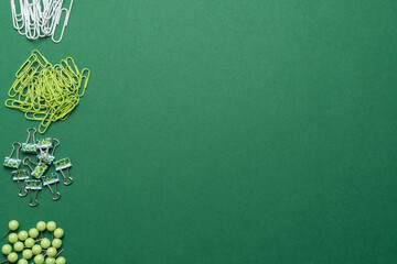 Fototapeta na wymiar Stationery in green on a green background