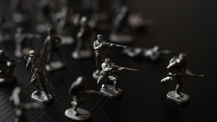 The concept of war and confrontation, political crises, toy tin soldiers attacking each other