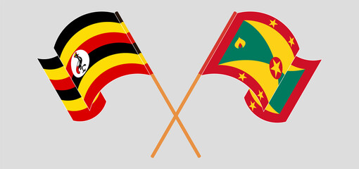 Crossed and waving flags of Uganda and Grenada