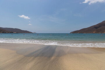 Beautiful shot of colombian concha bay located into Tayrona national park in sunny day