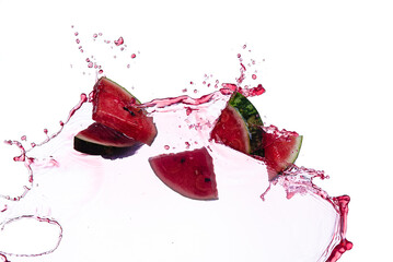 Watermelon slice with juice splash isolated on white background.