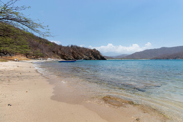 Beautiful landscape of small Waikiki Island aquarium located in Colombian National Natural Park with Sierra Nevada Mountains and Concha bay at background.