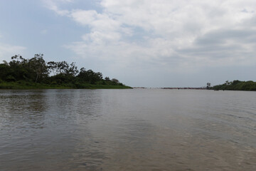 Stunning Colombian Palomino river landscape with sky water reflection and cloudy sky