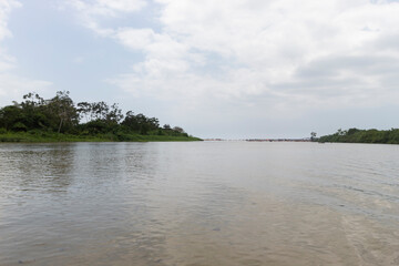 Colombian Palomino river mouth landscape with tourist and caribbean sea at background