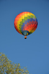 moment of takeoff of colorful hot air balloon