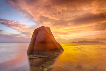 Fotobehang Lonely rock in the sea in Seychelles © Fyle