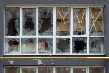 Smashed window broken glass break. Destroyed building broken frame window plastic. Aftermath bombed...