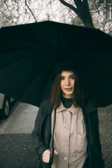 Emotional portrait, girl with umbrella, emotion - reaction to surprise, fright